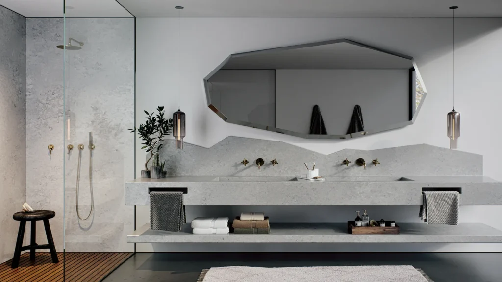 Soft gray and creamy white quartz bathroom countertops in a hotel setting, blending durability with a clean, airy, and practical design.