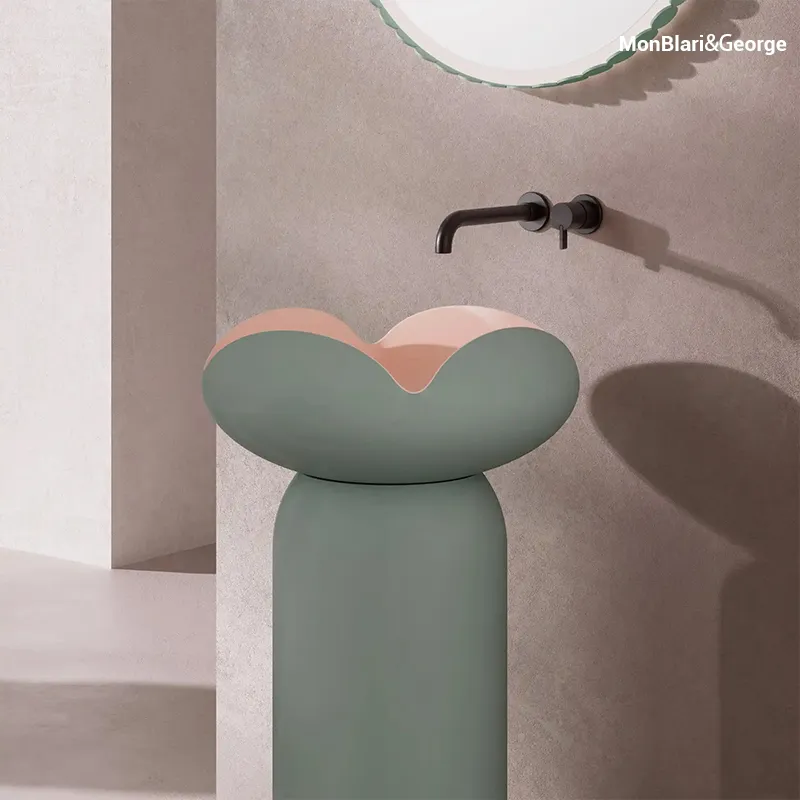 Petal-inspired sculptural freestanding basin with a tulip-shaped solid surface bowl and seamless one-piece pedestal, creating a refined modern bathroom centerpiece.
