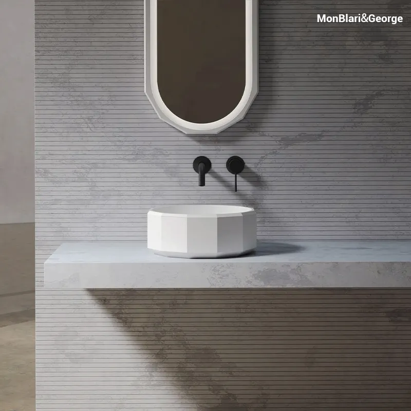 Architectural diamond-cut basin design that catches light and creates visual depth with its multi-faceted surface.