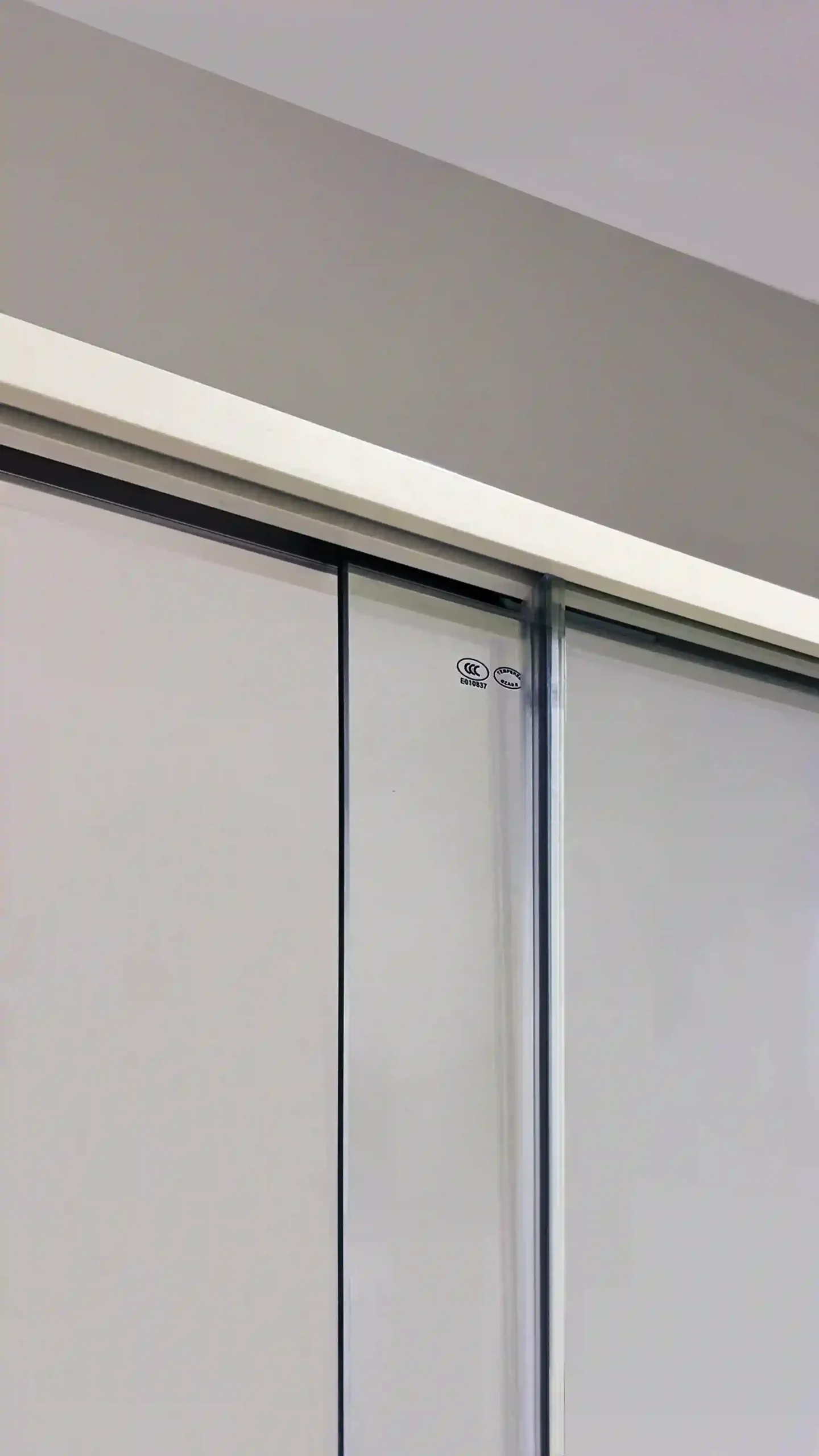 PS19811 brushed nickel 2-panel sliding shower door with ultra-slim clip-free frame, recessed rollers, 8mm tempered clear safety glass and integrated towel bar.