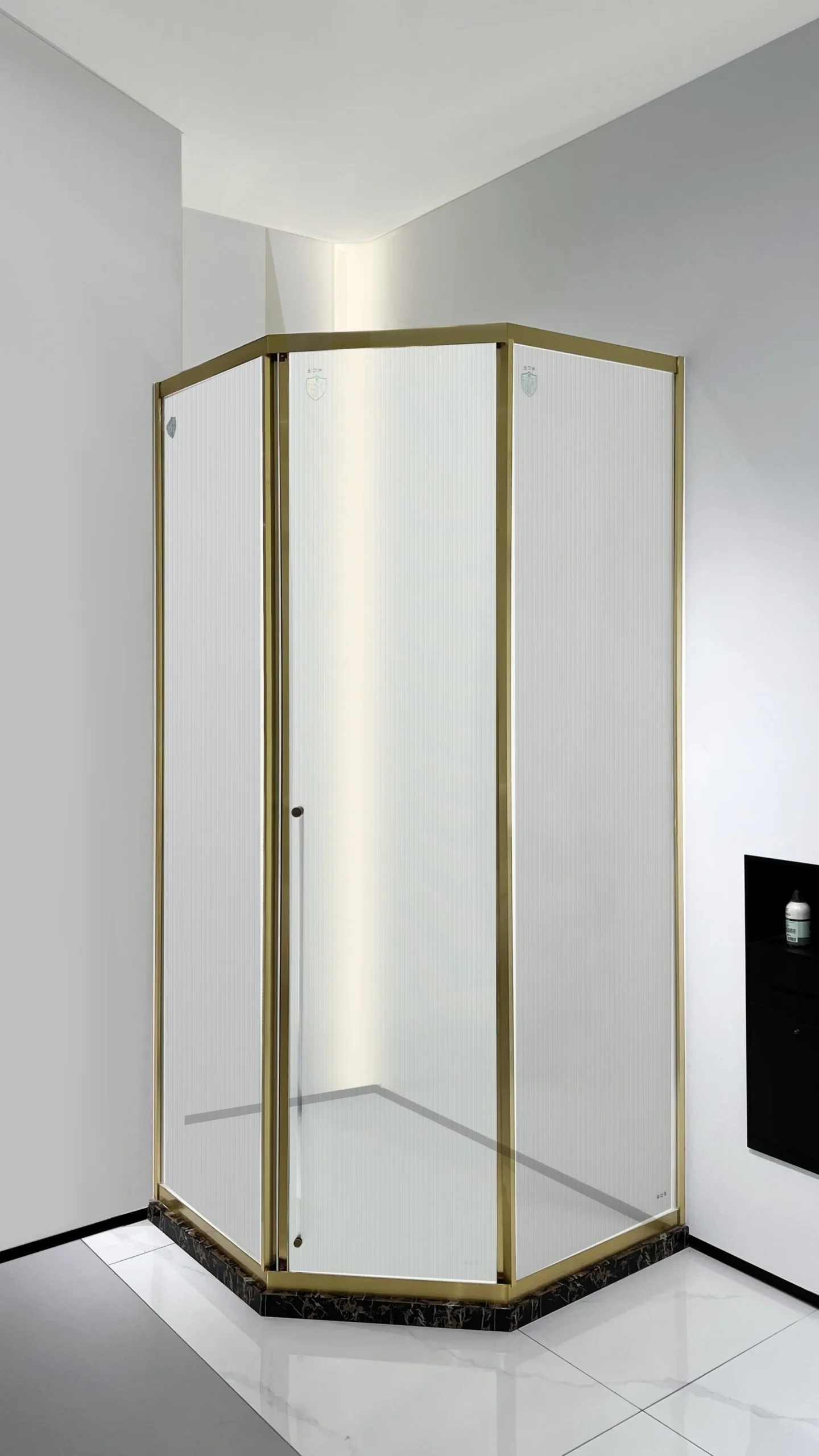 ZS15921 brushed brass neo-angle corner shower enclosure with hinged door, frosted tempered glass, slim frame, showing 180° dual-swing pivot for space-saving access. Select 75 more words to run Humanizer.