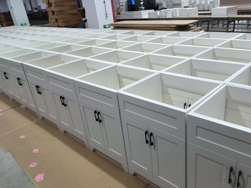 Pre-shipment inspection (PSI) of fully assembled commercial white bathroom vanities for a bulk hotel project to ensure dimensional accuracy.