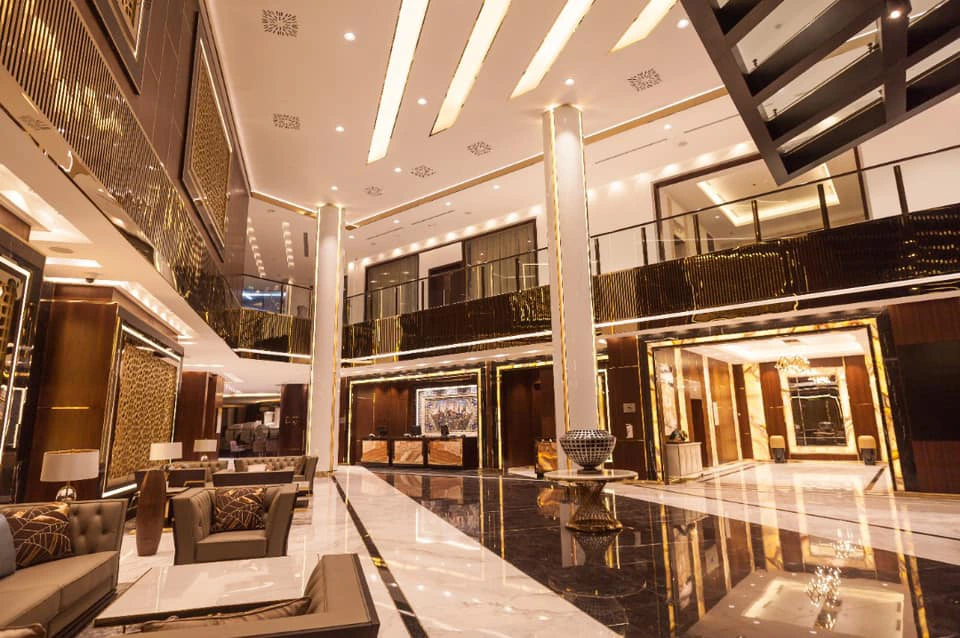 Custom white and black marble countertop installation for hotel vanity