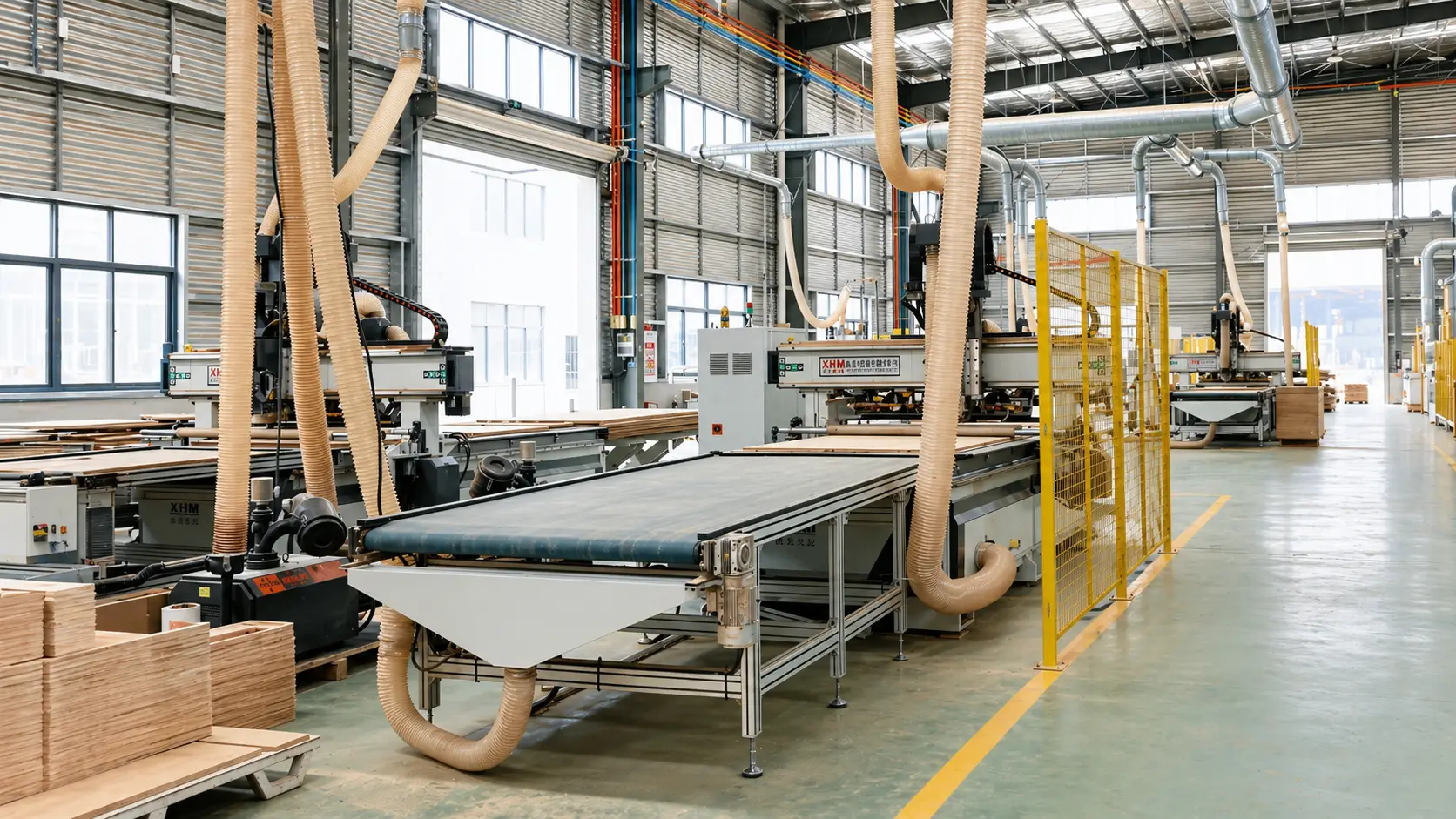 Automated CNC nesting machines in a factory, streamlining wood panel production for hotel vanity value engineering.