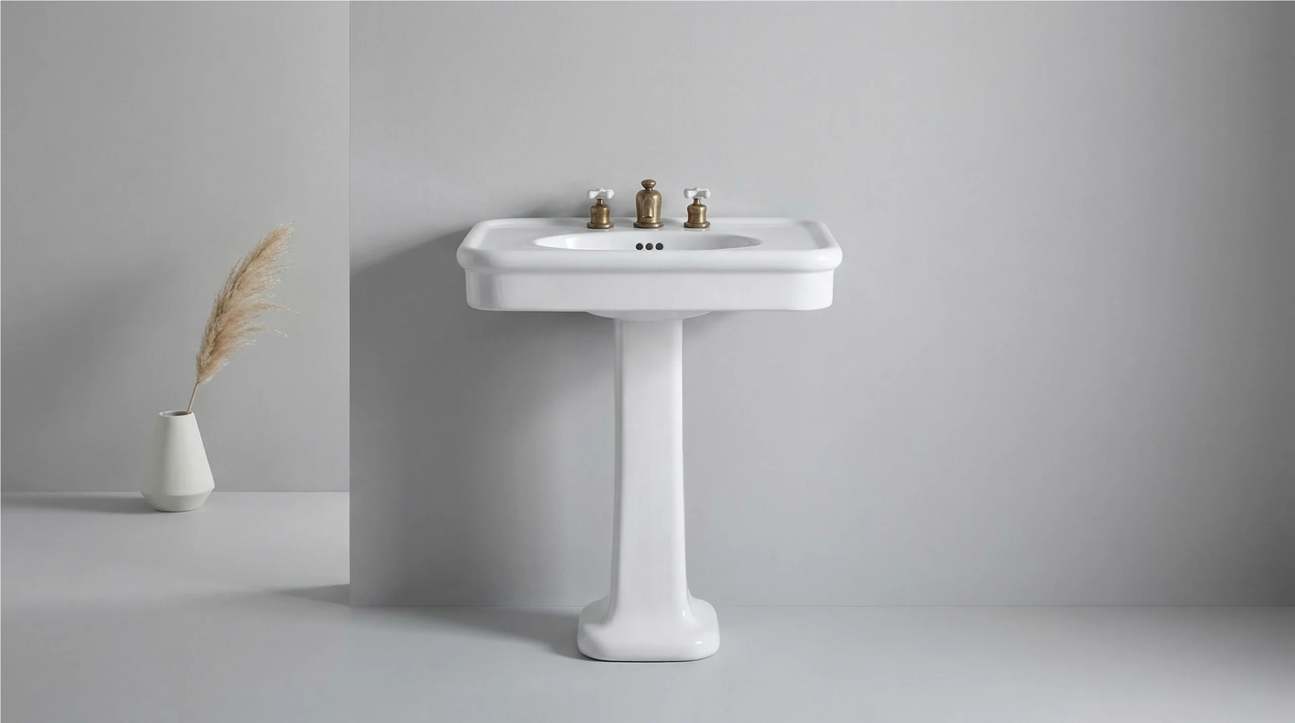 Vintage porcelain pedestal sink manufactured for classic commercial projects