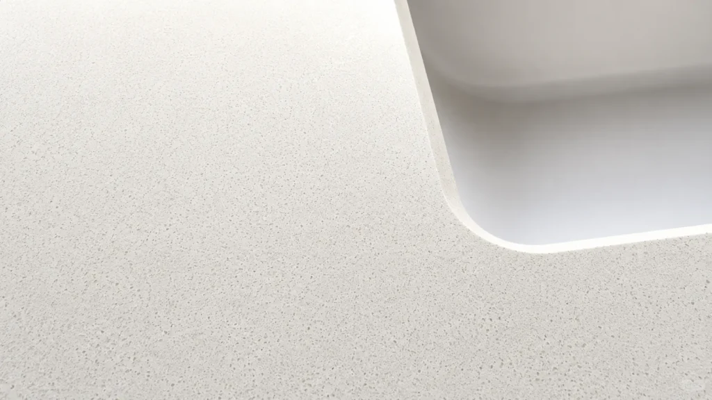 Durable white quartz hotel vanity top with seamless sink cutout, featuring a stain-resistant surface for high-traffic use.