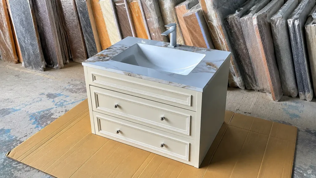 Cream Shaker bathroom vanity with quartz top and silver hardware, meeting US specs for hotel and apartment projects.