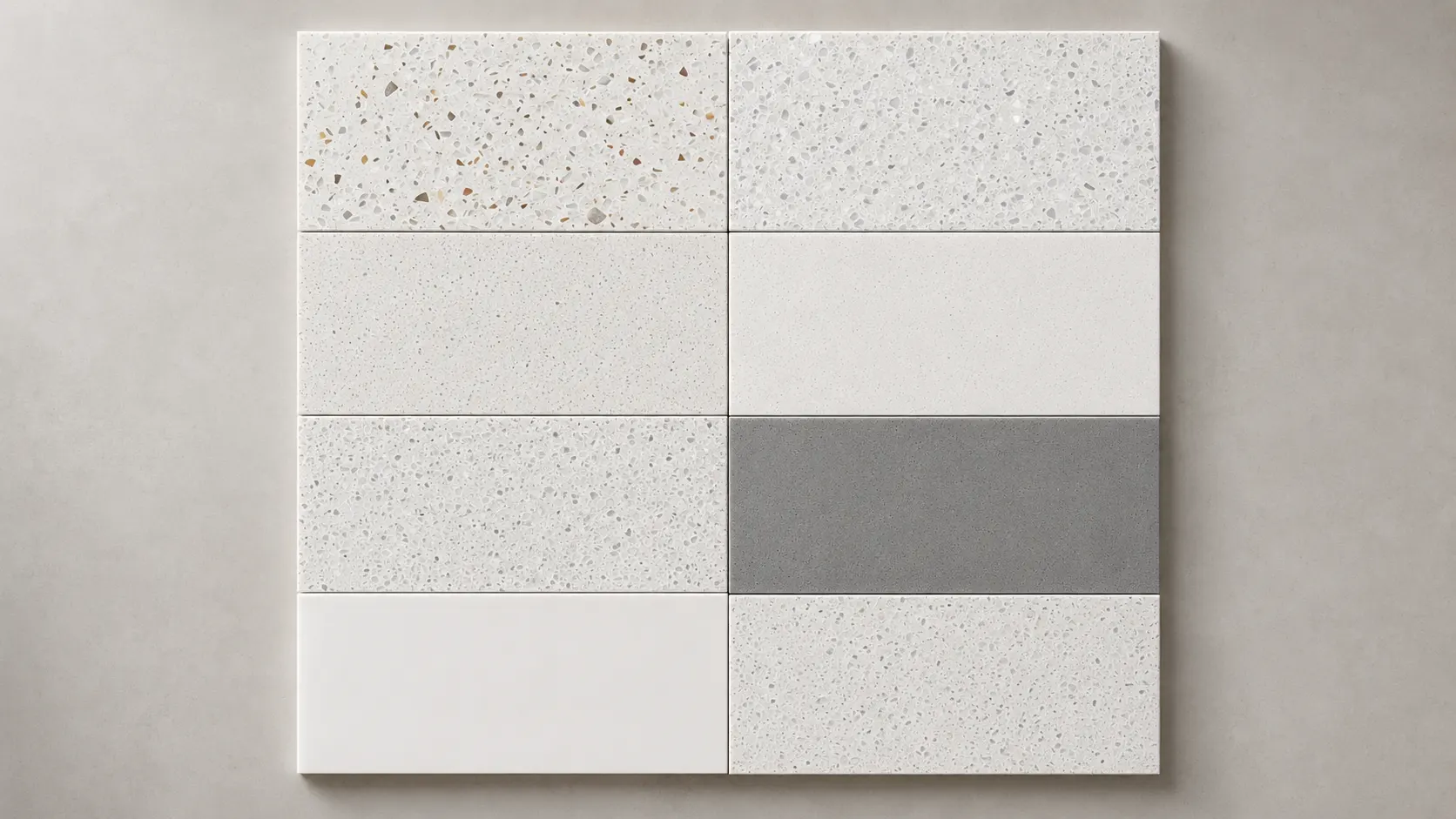 White and grey solid surface samples for hotel vanity tops, featuring repairable textures for seamless commercial projects.